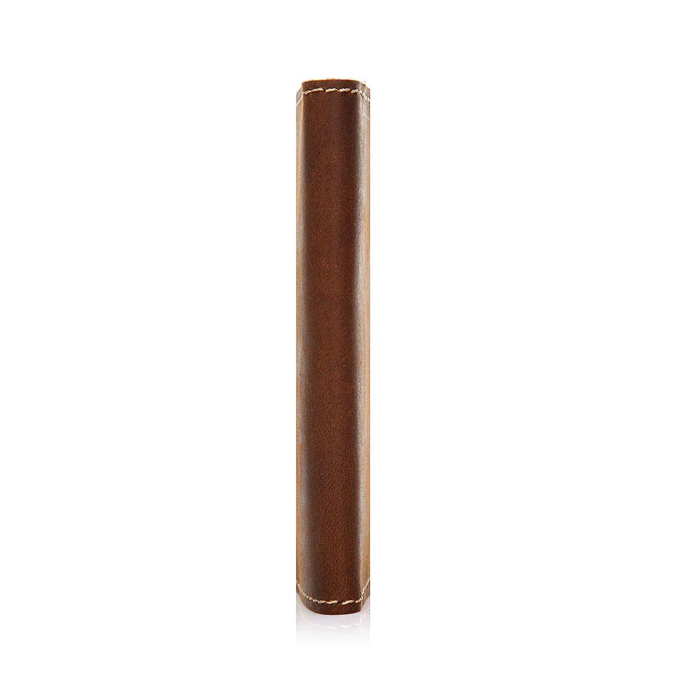 Brown cylindrical object with decorative stitching on a white background